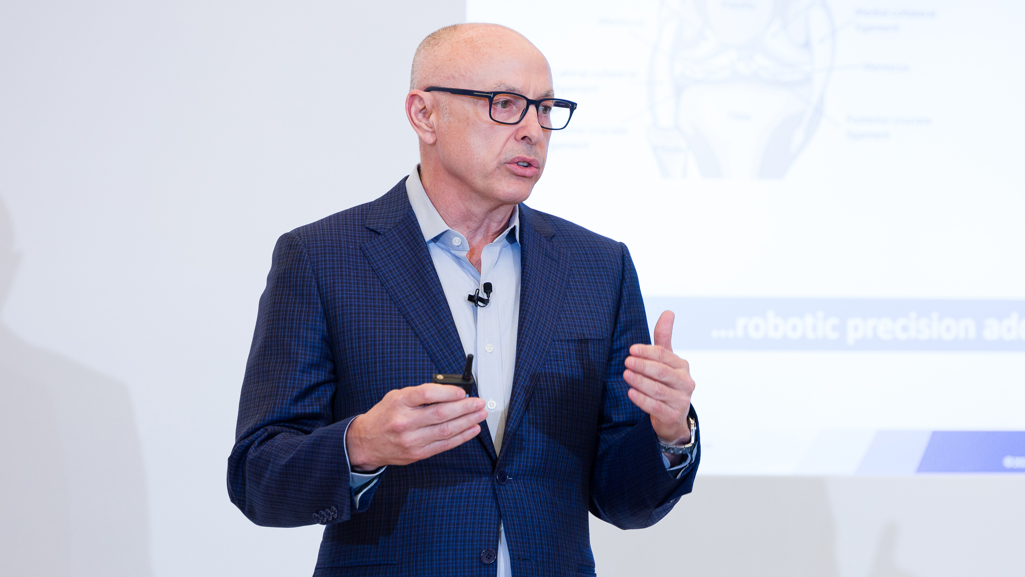Stuart Simpson, President & CEO of THINK Surgical, presenting on stage at LSI USA 2026
